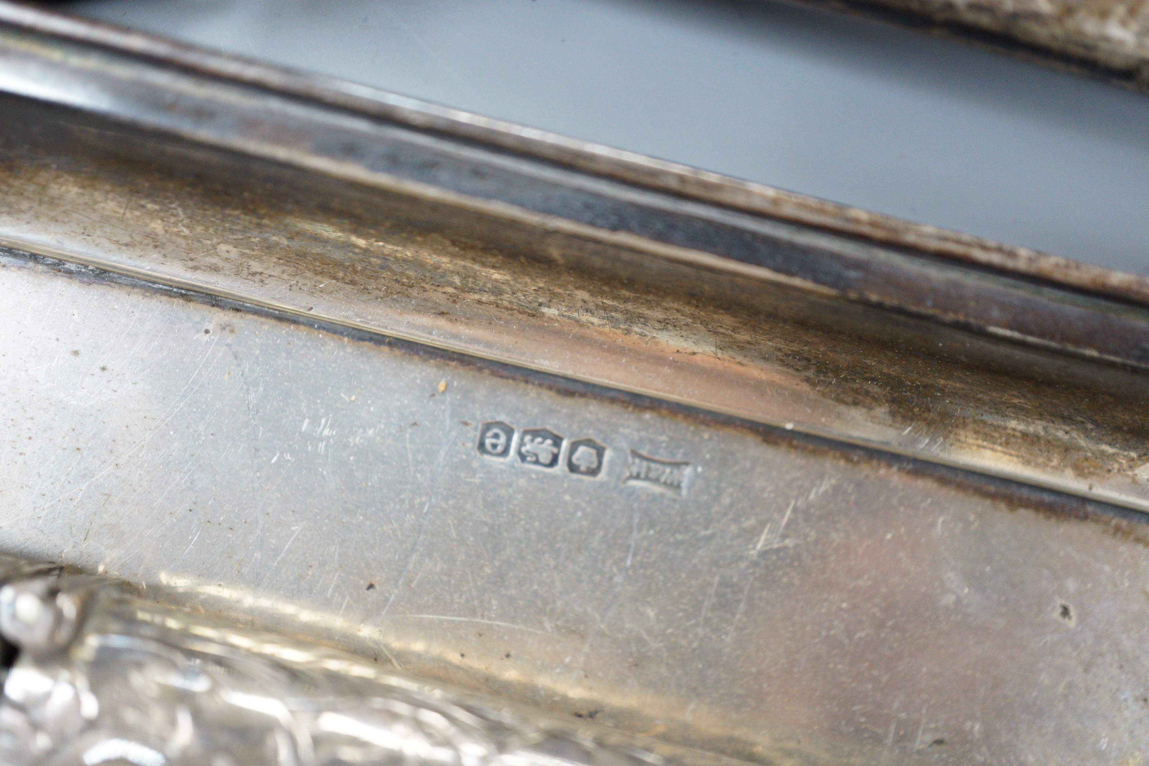 A mixed collection of silver to include cutlery, napkin rings, photograph frame, card cases, small dish, etc.
